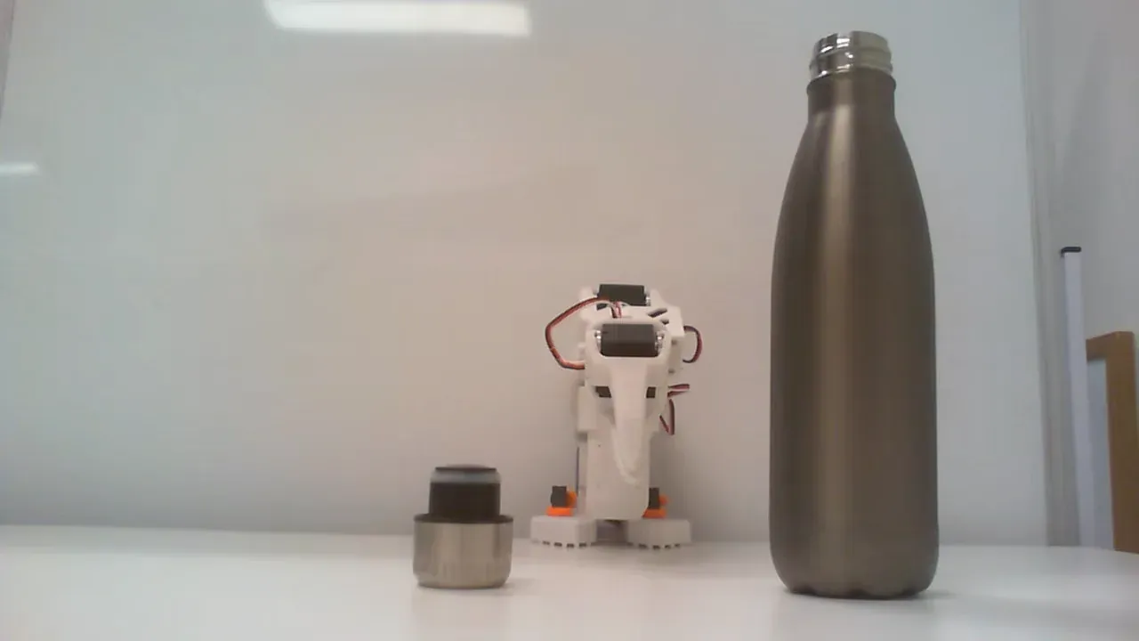 Front camera view of the Bottle Lid workspace with bottle and detached lid.