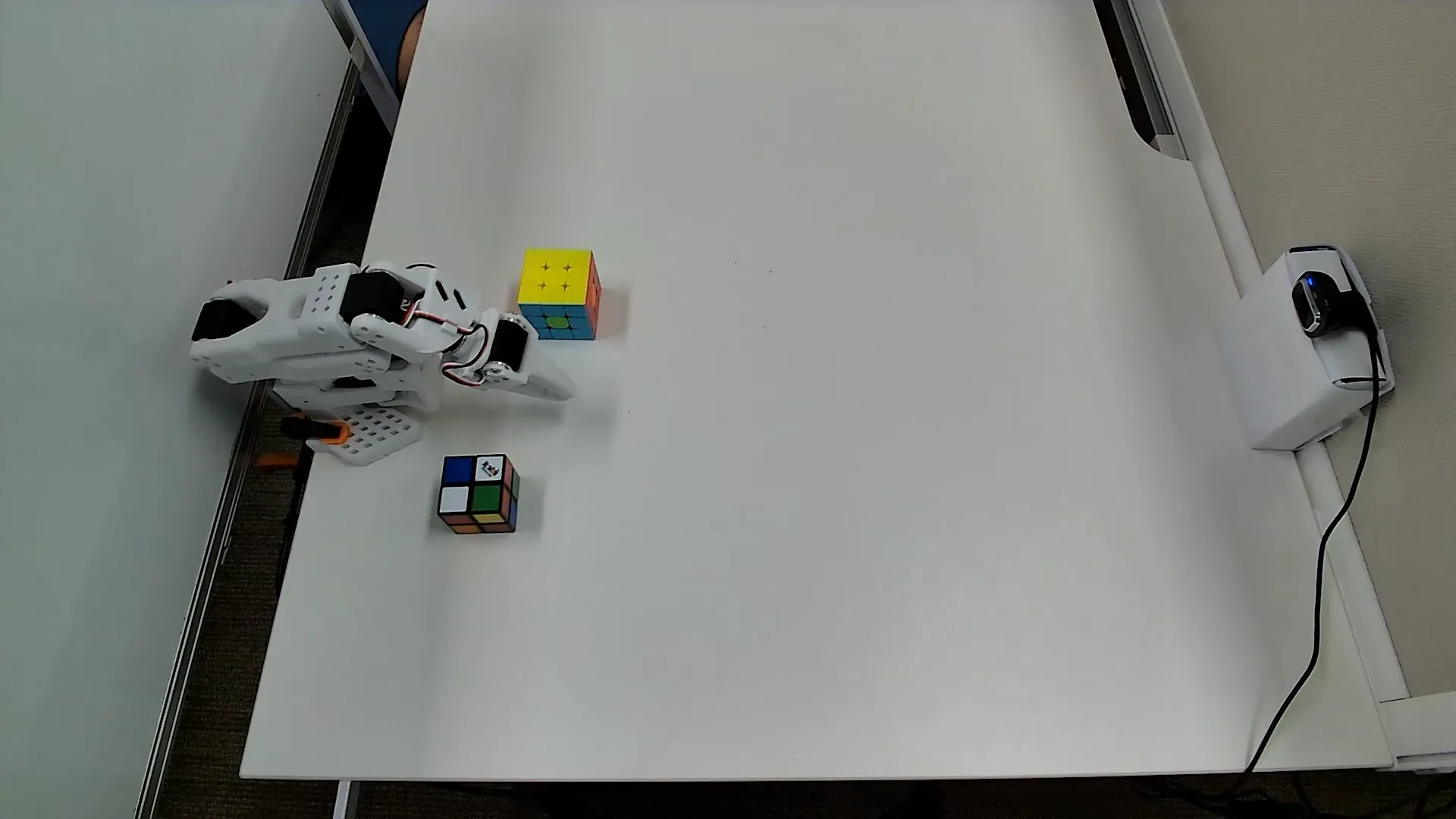 Top camera view of the Rubik's Stack workspace showing the cube arrangement and reachable region.